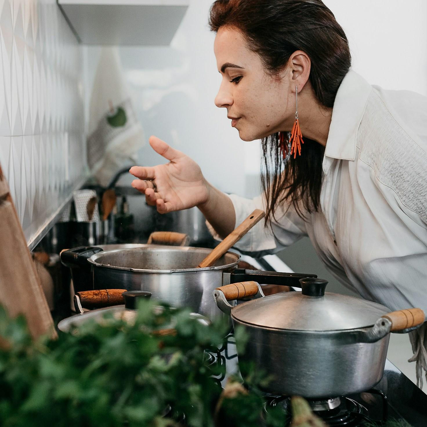 Community members collaborating in a modern kitchen space, sharing recipes and cooking techniques